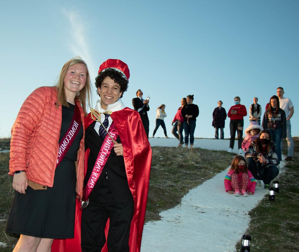 Homecoming royalty posing on c-hill